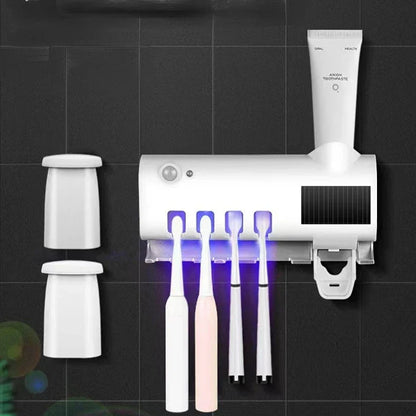 Automatic toothpaste dispenser with brush holder