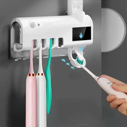 Automatic toothpaste dispenser with brush holder